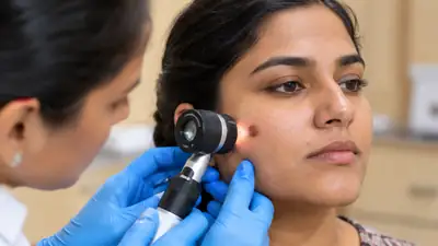 Dermatologist examining facial mole with dermatoscope