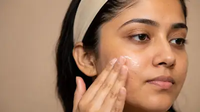Young Woman Applying Facial Moisturizer Cream - Clinical Dermatology Photo