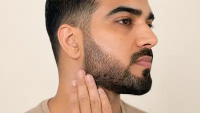 Man Applying SPF Sunscreen Protection on Beard and Face Skin