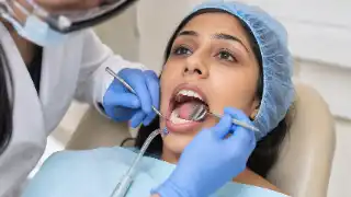Patient Receiving Posterior Dental Filling Procedure at Dentist Clinic