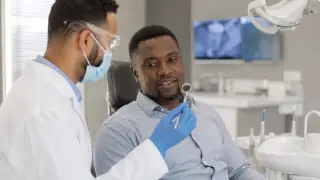 Dentist Examining Patient Teeth During General Checkup Consultation