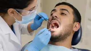 Comprehensive Oral Exam Performed By Dentist In Dental Clinic - Stock Photo