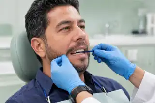 Dentist Checking Bite Occlusion With Articulating Paper - Dental Care Photo