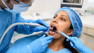 Posterior Dental Implant Placement Procedure by Dentist in Clinic - Clinical Stock Photo