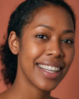 Young Woman Smiling with Clear Dental Aligners - Orthodontic Treatment Photo