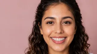 Young Woman Smiling With Ceramic Braces - Dentistry Stock Photo