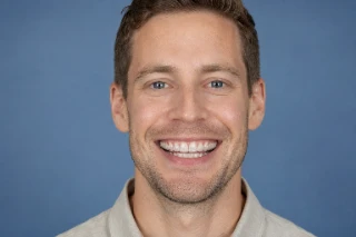 Adult Male Smiling While Wearing Clear Aligners Dental Braces